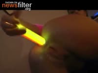 Fun seeking teen cam model entertains her viewers with multiple light stick insertions while live